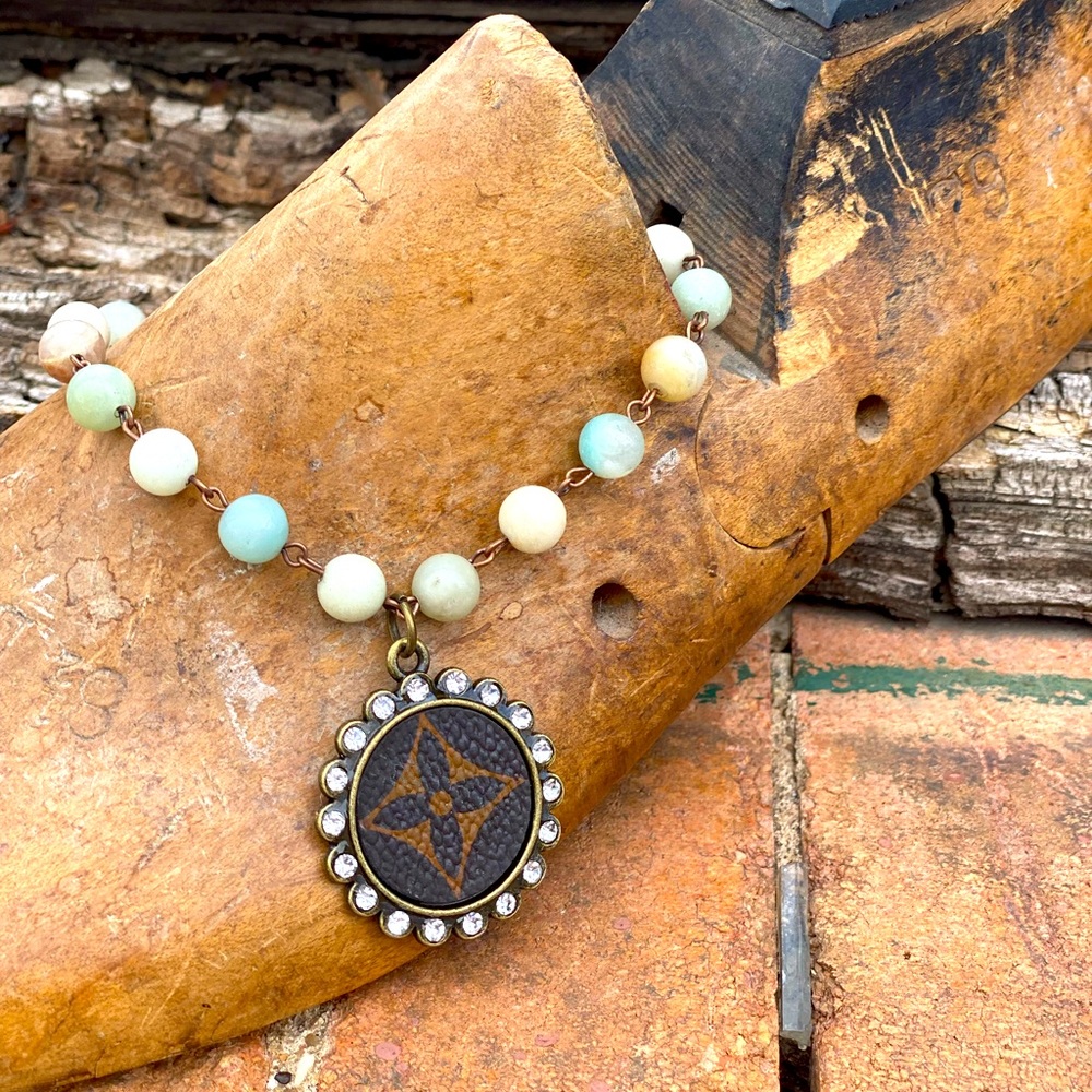 Beaded necklace with authentic LV emblem.